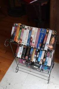 lot 510 image: Rack full of collection of vhss see pictures for titles