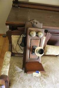 lot 512 image: antique oak wall-mounted crank telephone from the early 1900s, featuring double brass bells and a black receiver