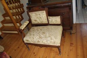 lot 513 image: Victorian Eastlake settee with a carved mahogany frame and upholstered seat and back