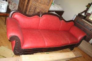 lot 517 image: antique Victorian sofa featuring a carved wood frame and red leather upholstery