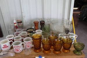 lot 546 image: A mix of kitchen items like Indiana Glass Whitehall amber footed juice glasses and  University of Arkansas Razorbacks mugs and  punch bowl set and so much more see pictures for details