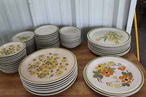 lot 547 image: Spring Bouquet stoneware plates made in Japan, featuring a yellow floral design with a green rim some have chips see pictures for details