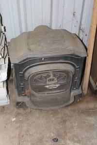 lot 550 image: vintage Vermont Castings Resolute wood-burning stove, likely dating from the late 1970s to early 1980s
