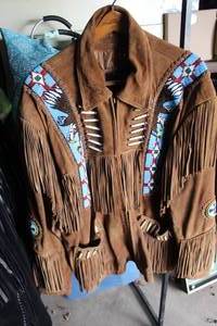 lot 578 image: Size XXL vintage suede leather jacket featuring intricate blue and white beadwork and fringe details in a Native American western style