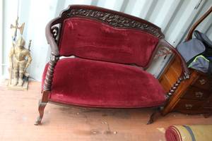 lot 592 image: antique Victorian Eastlake style settee featuring a carved walnut frame and red velvet upholstery