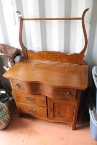 lot 607 image: antique pine or oak washstand with a serpentine drawer and harp-back towel rack