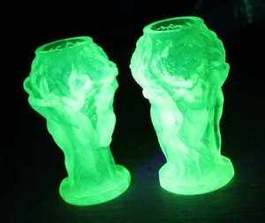 vintage Desna Vaseline uranium glass vase featuring sculpted figures in a "Harvesting Venuses"