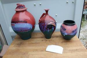 lot 649 image: three handcrafted terracotta pottery vessels featuring a distinctive blue and white glaze effect