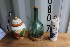 lot 662 image: hand-painted ceramic biscotti jar featuring a fruit motif and a lidded design and  vintage Italian green hand-blown glass wine decanter. And Delft Blue ceramic bottle