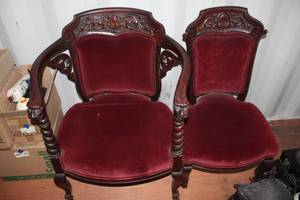 lot 664 image: Victorian-style parlor armchairs featuring intricate dark wood carvings and deep red velvet upholstery