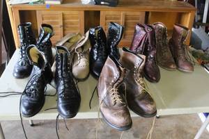 lot 694 image: collection of used leather boots, which appear consistent with military-style footwear. Sizes 9 12 to 10
