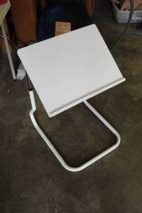 lot 715 image: white TV tray table featuring a metal frame and a plastic top