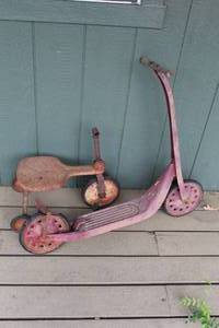 lot 727 image: antique, rusty metal and wood childs scooters