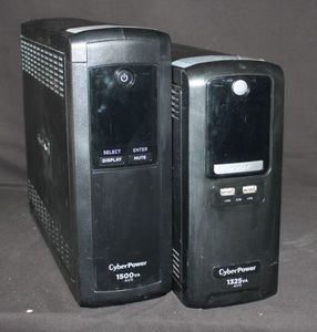 Two CyberPower uninterruptible power supply units 1500VA AVR model on the left and a 1325VA AVR model on the right