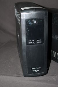Two CyberPower uninterruptible power supply units 1500VA AVR model on the left and a 1325VA AVR model on the right