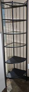 lot 209 image: Metal and glass corner shelf slightly taller and 5ft