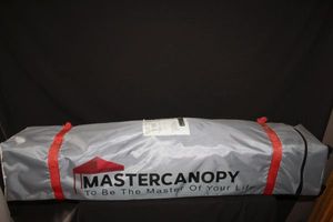lot 12 image: Master canopy 10x10 Pop up Canopy and Case
