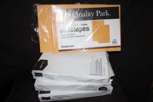 lot 19 image: Three Reems of 11x17 White Paper and 12.5x18.5 inch Envelopes