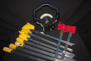 lot 30 image: Crescent Lufkin Fiberglass 100ft Long Tape Measure and approx 700 Yellow and 200 Red Marking Flags