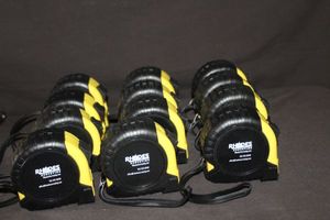 lot 39 image: Twelve Promotional Tape Measures