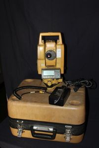 lot 40 image: Topcon PGT-3002LW Surveying total Station and case, with Battery, Charger, and Data Cord.&nbsp Powers on as seen in Photos