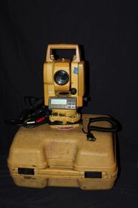 lot 51 image: Topcon GTS-300 Series total Station, with Battery, Charger, and Data Cord. Powers on as seen in Photos