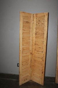 lot 106 image: Natural wood Shutter Door 36x80x1.5