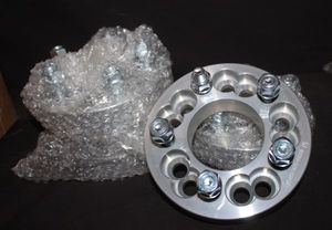 lot 117 image: Four Dual Pattern Wheel Spacer Adapter