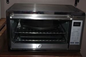 lot 155 image: Stainless Steele Convection Oven with Pizza pans and cookie sheet