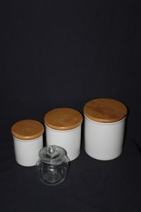 lot 165 image: Three White Ceramic Canisters with tight seal and clear class canister