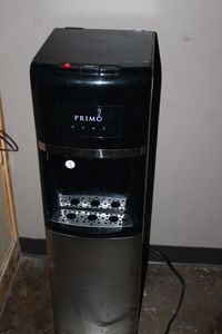 lot 169 image: Primo water dispenser hotcold water empty bottle included