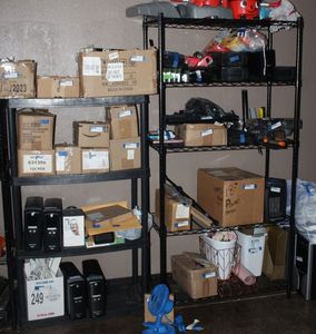 lot 239 image: Four ft tall plastic shelf and 6 ft tall metro rack... Contents not included