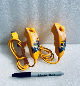 lot 199 image: Lot Of 2 - Power A Nunchuks For Nintendo Wii, Skylanders Special Edition Artwork Design, Orange - In Condition As Shown