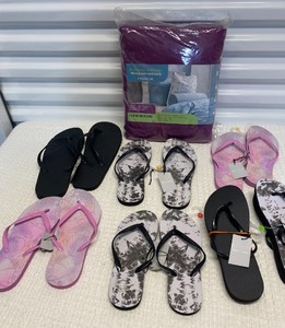 lot 293 image: Lot Of 7 - (6) Mixed Size Small, Medium, Large & XL Flip Flops & (1) Disposable King Size Sheet Set - In Style & Condition As Shown