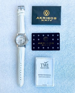 lot 430 image: Akribos XXIV Diamond White Mother of Pearl Dial Ladies Watch, AK580SSW - In Condition As Shown - (READ)
