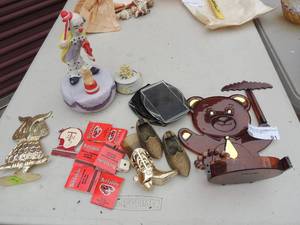lot 91 image: Jewlery stands,  Brass Shoes,  Clown and Red Lobster matches and more