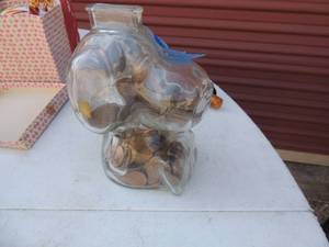 lot 140 image: Glass Snoopy bank Full of coins