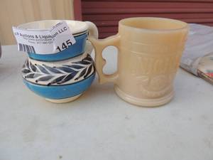 lot 145 image: What a burger 5 cent coffee mug and Native American coffee mug