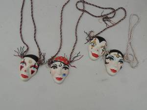lot 175 image: 4 ceramic masks with cord