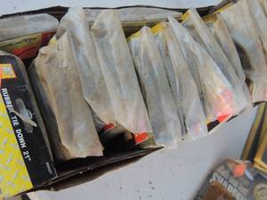 lot 282 image: NIP 21 rubber tie downs ( several)