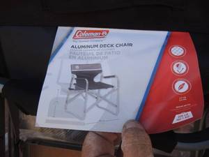 lot 311 image: NEW Coleman aluminum deck chair with attached side table