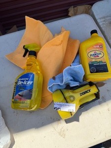 lot 413 image: Oil, deicer, flashlight and shammy