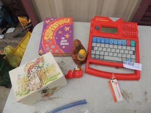 lot 506 image: TI SUPER SPEAK SPELL, KIDS JEWELRYY BOX, SUPERFUDGE PLUS MORE