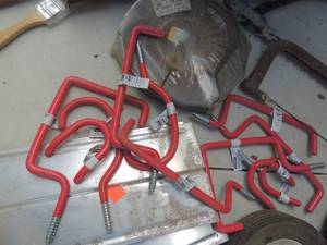 lot 563 image: Storage hooks Bike hooks and wheels