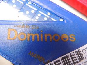 lot 575 image: Miniature dominoes and a wooden nickel