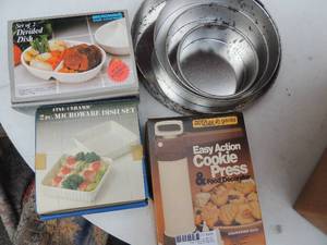lot 595 image: NEW Divided dish x2, 2 piece microwave dish set, cookie press and cake pans