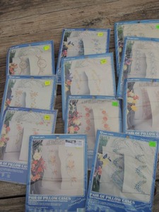lot 663 image: Embroidery projects pillow case SETS OF 2  per pkg, 3 different patterns  Total 11 packages