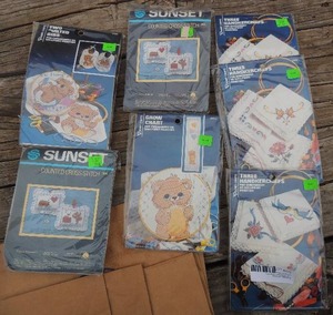 lot 673 image: Cross stich growth chart 3 sun pillows 3 hankies seven pks total