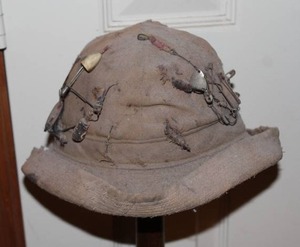 lot 3 image: pith helmet, specifically a style often associated with the North Vietnamese Army (NVA) with lures and stand