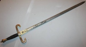 lot 100 image: Toledo Spain decorative sword with ornate Hilt cast-metal cross guard (quillons) and wire-wrapped black grip